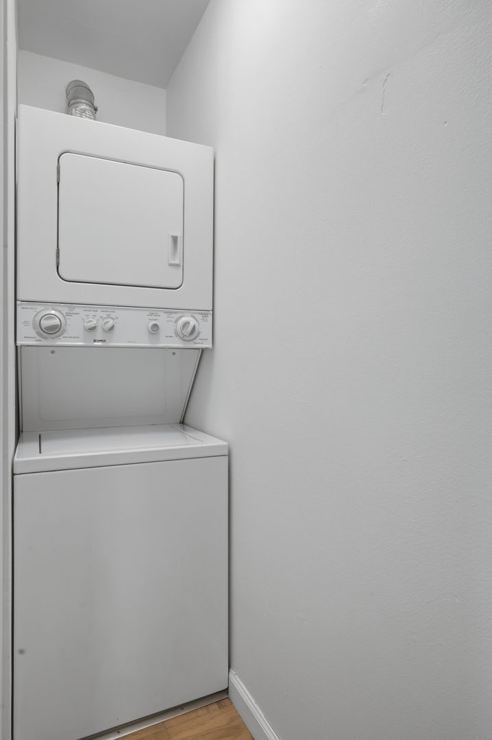 Stacked washer and dryer in a recessed alcove