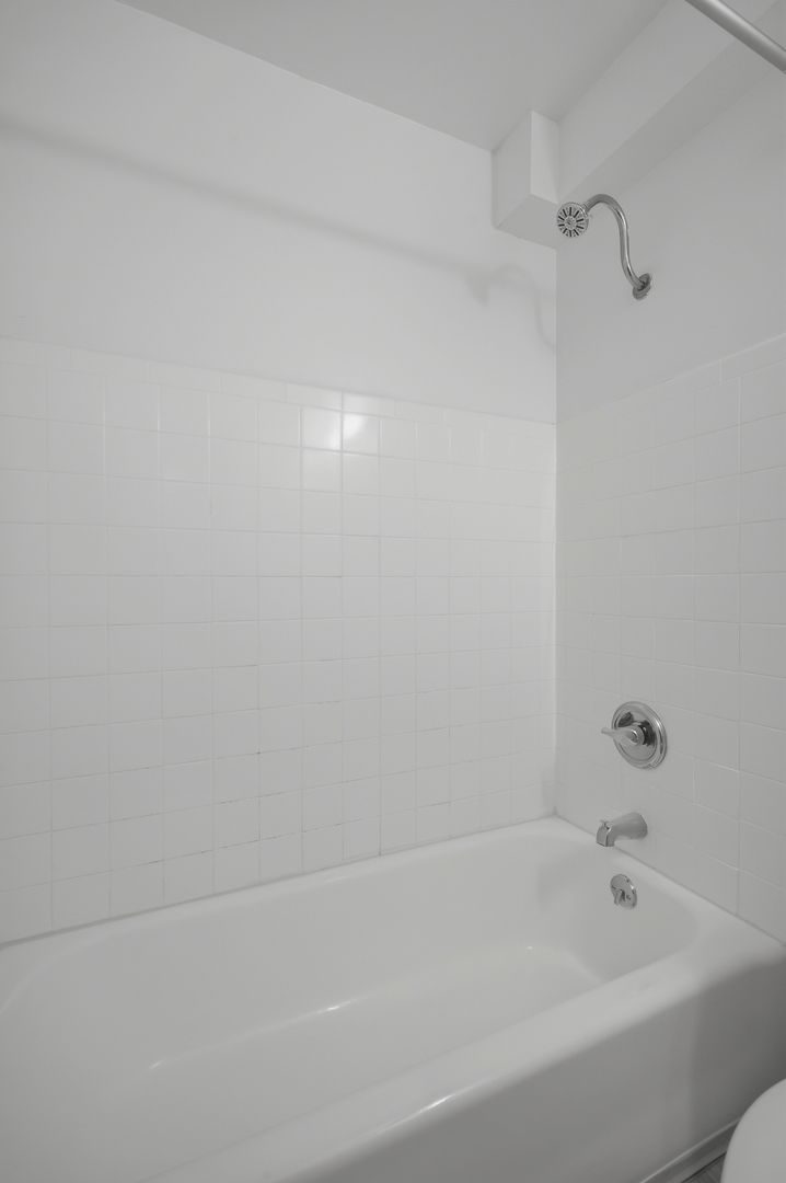 Tub and shower enclosure